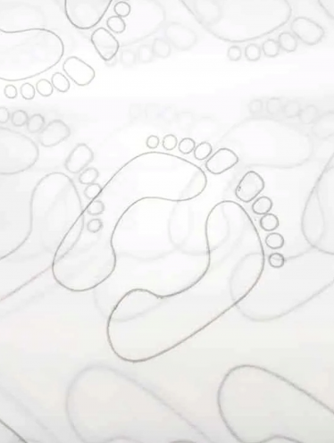 Dywanik włókninowy jednorazowy w rolce ze stopami (100 szt)